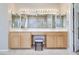 Well-lit bathroom with double vanity, mirrors with lighting, and tiled floor at 1744 Williamsport St, Henderson, NV 89052