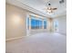 Carpeted bedroom with bay windows offering views of the landscape at 1744 Williamsport St, Henderson, NV 89052