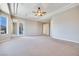 Spacious carpeted bedroom with access to an outdoor balcony at 1744 Williamsport St, Henderson, NV 89052