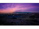 Panoramic night view of the city skyline and mountain range at 1744 Williamsport St, Henderson, NV 89052