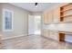 Stylish office features light hardwood floors and custom wood cabinets, creating a functional workspace at 1744 Williamsport St, Henderson, NV 89052