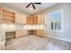Well lit office with custom wood cabinetry and hardwood floors, offering ample storage and workspace at 1744 Williamsport St, Henderson, NV 89052
