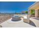 Inviting outdoor living area with built-in seating, gas fire pit, and scenic views at 1744 Williamsport St, Henderson, NV 89052