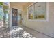 Inviting outdoor patio area with a covered entrance, a sliding glass door, and access to the backyard at 1744 Williamsport St, Henderson, NV 89052