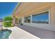 A spacious covered patio with outdoor seating, lush landscaping, and great views at 1744 Williamsport St, Henderson, NV 89052