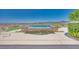 Backyard pool with waterfall feature, artificial turf and mountain views, creating a serene outdoor oasis at 1744 Williamsport St, Henderson, NV 89052