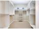 Spacious walk-in closet with carpet and built-in shelving units for optimal organization at 1744 Williamsport St, Henderson, NV 89052