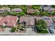 An aerial shot showcasing a well-maintained house among green trees, featuring a 3-car garage at 2262 Alanhurst Dr, Henderson, NV 89052