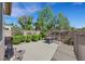 Private backyard with a patio, swing, and manicured landscaping at 2262 Alanhurst Dr, Henderson, NV 89052
