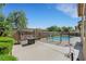 Spacious backyard with patio, swing, a pool, and lush greenery at 2262 Alanhurst Dr, Henderson, NV 89052