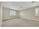 Bedroom featuring neutral carpet, paint and shuttered windows providing natural light at 2262 Alanhurst Dr, Henderson, NV 89052