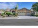 Charming single-story home featuring a three-car garage and well-manicured landscaping at 2262 Alanhurst Dr, Henderson, NV 89052