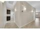 Hallway featuring tile floors, recessed lights and neutral paint with laundry room and secondary room access at 2262 Alanhurst Dr, Henderson, NV 89052