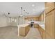 Bright kitchen featuring an island, stainless steel appliances, and tile flooring at 2262 Alanhurst Dr, Henderson, NV 89052