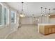 Open-concept living space with tile flooring, abundant natural light, and seamless flow at 2262 Alanhurst Dr, Henderson, NV 89052