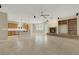 Open-concept living area with stone fireplace, built-in shelves, and tile flooring throughout at 2262 Alanhurst Dr, Henderson, NV 89052