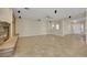 Spacious living area with tile flooring, stone fireplace, and ample room for entertaining at 2262 Alanhurst Dr, Henderson, NV 89052