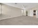 Bright bedroom with neutral carpet and paint, ceiling fan, shuttered windows, and ensuite access at 2262 Alanhurst Dr, Henderson, NV 89052