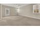 Spacious bedroom with neutral carpet, ceiling fan, shuttered windows, and access to the backyard at 2262 Alanhurst Dr, Henderson, NV 89052