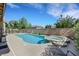 Backyard oasis features a refreshing pool, relaxing spa, and lush landscaping at 2262 Alanhurst Dr, Henderson, NV 89052