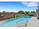 Beautiful backyard pool and spa surrounded by privacy walls and lush landscaping at 2262 Alanhurst Dr, Henderson, NV 89052