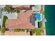 Aerial view of a home with a private pool, waterfront access, and a well-maintained roof at 2469 Sun Reef Rd, Las Vegas, NV 89128