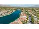 Expansive aerial view of a waterfront community surrounded by beautiful landscaping and scenic waterways at 2469 Sun Reef Rd, Las Vegas, NV 89128