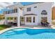 Backyard with a pool, patio, turf, and balcony, perfect for entertaining and enjoying the outdoors at 2469 Sun Reef Rd, Las Vegas, NV 89128