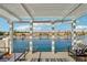 Balcony view of the community waterfront features stylish furniture, a pergola, and black metal railings at 2469 Sun Reef Rd, Las Vegas, NV 89128