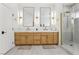Bathroom features double vanities, modern mirrors and a glass enclosed shower at 2469 Sun Reef Rd, Las Vegas, NV 89128