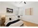 Comfortable bedroom featuring modern decor, wood flooring, and bright natural light at 2469 Sun Reef Rd, Las Vegas, NV 89128