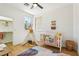 Bedroom features a crib, tent, and walk-in closet, offering plenty of space for your little one at 2469 Sun Reef Rd, Las Vegas, NV 89128