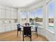 Light-filled breakfast nook with backyard and pool views adjacent to the kitchen at 2469 Sun Reef Rd, Las Vegas, NV 89128