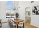 Bright dining room with lake views and modern chandelier at 2469 Sun Reef Rd, Las Vegas, NV 89128
