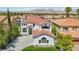 Elegant two-story home with a tile roof, well-manicured lawn, and a spacious driveway at 2469 Sun Reef Rd, Las Vegas, NV 89128