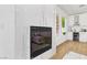 Modern fireplace with marble surround near a wet bar at 2469 Sun Reef Rd, Las Vegas, NV 89128