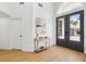 Entrance foyer with double doors, hardwood floors, console table, and lots of natural light at 2469 Sun Reef Rd, Las Vegas, NV 89128