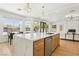 Open kitchen featuring large island with dishwasher and breakfast bar seating at 2469 Sun Reef Rd, Las Vegas, NV 89128