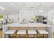 Spacious kitchen with marble countertop island, stainless steel appliances, and pendant lighting at 2469 Sun Reef Rd, Las Vegas, NV 89128