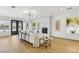 Spacious living room features a marble fireplace, modern lighting, wood floors, and sliding glass doors at 2469 Sun Reef Rd, Las Vegas, NV 89128