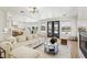 Bright living room featuring lake views, and an open floorplan at 2469 Sun Reef Rd, Las Vegas, NV 89128