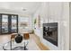 Modern living room with a fireplace and outdoor access at 2469 Sun Reef Rd, Las Vegas, NV 89128