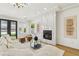 Relaxing living room with fireplace and plush seating for modern comfort at 2469 Sun Reef Rd, Las Vegas, NV 89128