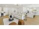 Open-concept living room with kitchen, comfortable seating, and stylish décor at 2469 Sun Reef Rd, Las Vegas, NV 89128