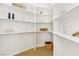Pantry with white shelves, laminate floors and plenty of storage space at 2469 Sun Reef Rd, Las Vegas, NV 89128
