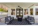 Covered patio featuring a modern fire pit and patio seating, perfect for outdoor gatherings at 2469 Sun Reef Rd, Las Vegas, NV 89128