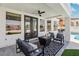 An outdoor living space featuring a fire pit, patio furniture, and pool at 2469 Sun Reef Rd, Las Vegas, NV 89128