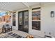 Covered patio offering scenic lake and mountain views, featuring a seating area at 2469 Sun Reef Rd, Las Vegas, NV 89128