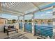 Patio features seating and lake views, creating a tranquil outdoor experience at 2469 Sun Reef Rd, Las Vegas, NV 89128
