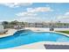 Backyard pool and tanning deck with lounge chairs, offering serene relaxation and stunning views of the community at 2469 Sun Reef Rd, Las Vegas, NV 89128